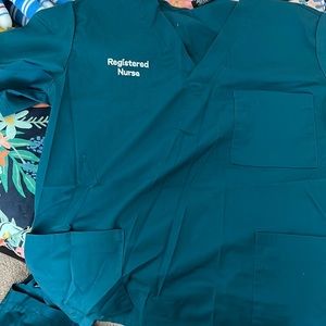 Carribean blue embroidered scrub shirts.